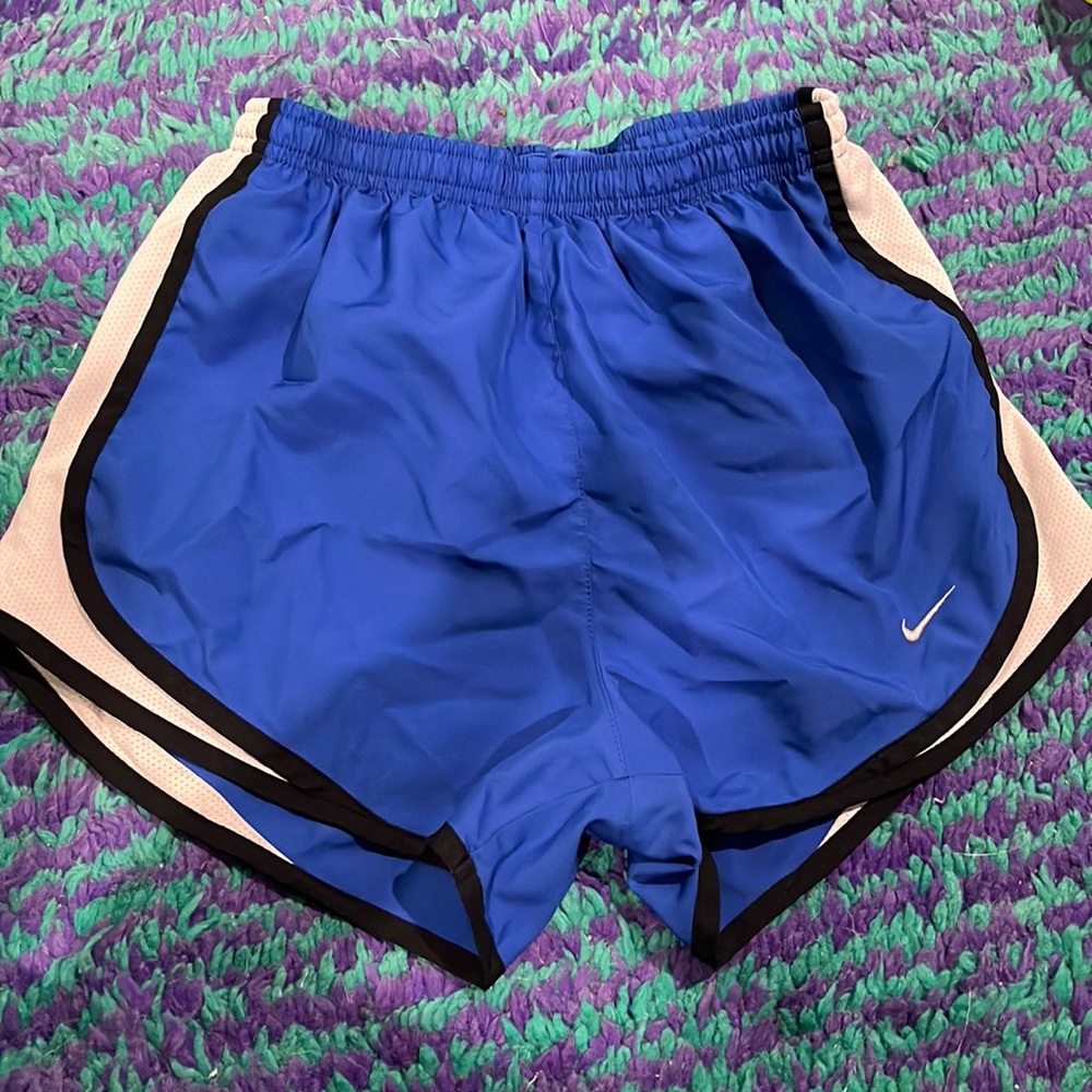 Blue Nike running shorts